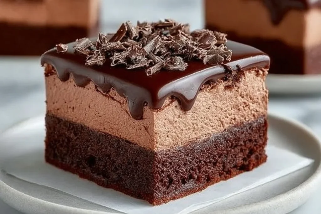 Decadent Chocolate Mousse Brownies topped with creamy mousse