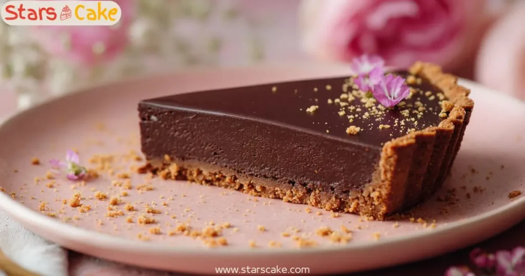 Slice of Pumpkin Dark Chocolate Tart with Floral Garnish Slice of pumpkin dark chocolate tart with cookie crust, garnished with pink flowers